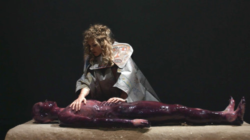 
     <i>Knot in Arrow: Ore Oral Orientation</i>, 
     2017<br />
     performance Videostill, 
      Length: 16:46 min, 16:9, Sound<br />
     Viva Arte Viva, curated by Christine Macel, 57. Biennale di Venezia