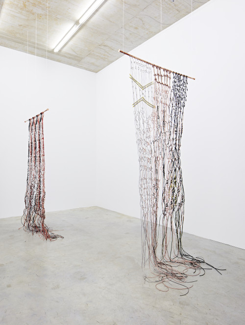 <i>Makramé, current flow 1 and 2</i>,
2017<br />
power cable, loudspeaker cable, Lan cable, Telephone cable, copper, zinc, PVC,
<br />
Installation view, Sammlung Philara, Düsseldorf, Germany, 2018