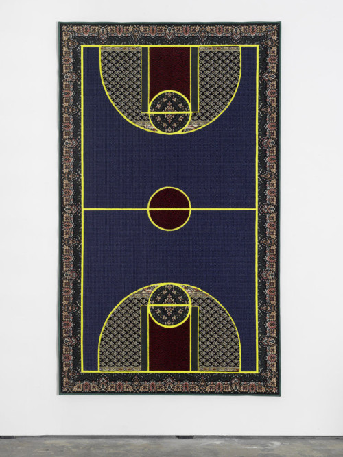 <i>Pattern Matching Blue</i>,
2010<br />
Kilims from Afghanistan, Iran and Turkey; hand-woven carpets from Iraq and India & industrially knotted carpets from Germany and China,
256 x 150 cm<br />
“Pattern Matching” brings together the seemingly disparate subjects of basketball, the famous American athletic export, and Oriental carpets, probably the most successful commercial product in the world that originates from the Middle East. Setting differences aside, lets consider these two incommensurable categories—the game and the object of everyday use—as two cultural expressions, in order to make the matching of their respective patterns possible and productive. Aladağ densely filled her carpets with a collage of ornamentation while respecting the lines and color fields that define the borders and mark important points on a basketball court. The artist proposes that we consider such patterns in the widest possible sense, going beyond their visual appearance: thus, they conjure conflicting patterns of behavior, opposing lifestyles and mutually exclusive rules that give shape to social and political realities of our supposedly globalized world and its distinctly local manifestations.
By overlapping or “matching” the patterns that belong to different semantic orders— that
of the “Western” game and the “Oriental” ornament—Aladağ produces a soft clash of meanings. The resulting hybrid objects, made of cut-out parts of existing carpets that are produced anywhere from Maghreb to China, Germany to Iraq, serve as evidence of conflicting ways of being and reveal patterns that don't match: mass event versus domesticity, action versus leisure, professional athletic games dominated by men versus women's domestic work, entertainment (as a secular religion) versus religion itself, the US versus the “rogue” states (that produce carpets) and perhaps even war versus peace... Each carpet displays a unique composition of colors and ornament, though the basic linear structure on which the colors and patterns are laid out remains the same for each piece. Meanings change, it seems, but the patterns still match, somehow. (excerpt from the text by Adam Szymczyk).