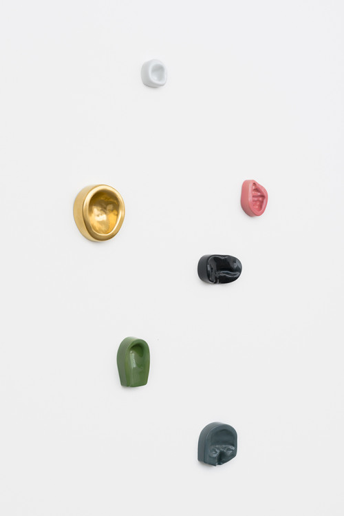 <i>Leaning Wall (6)</i>,
2013/2014<br />
Imprints of female and male body parts cast in colour-glazed Meissen porcelain,
various sizes<br />