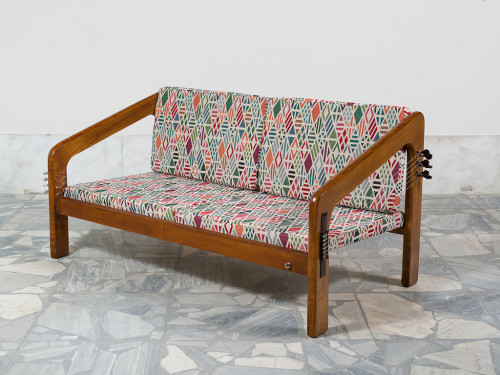 <i>Couch Flamenco Guitar and Mandolin (from the series Music Room, Athens)</i>,
2017<br />
Wood, Flamenco strings and mechanism on one side oak frame the couch and mandolin mechanism on the other side, amplification option,
61 x 127 x 68 cm<br />