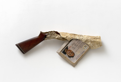 <i>Gag Gun</i>, 2021<br />Wood, deer rawhide, oil on linen, 36 x 88 x 9 cm<br />