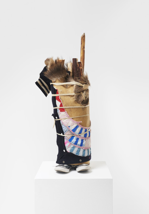 <i>Toes Out</i>, 2021<br />Converse shoes, spur, elk hide, textiles, leather, wood (lodge pole pine), 93 x 38 x 32 cm<br />